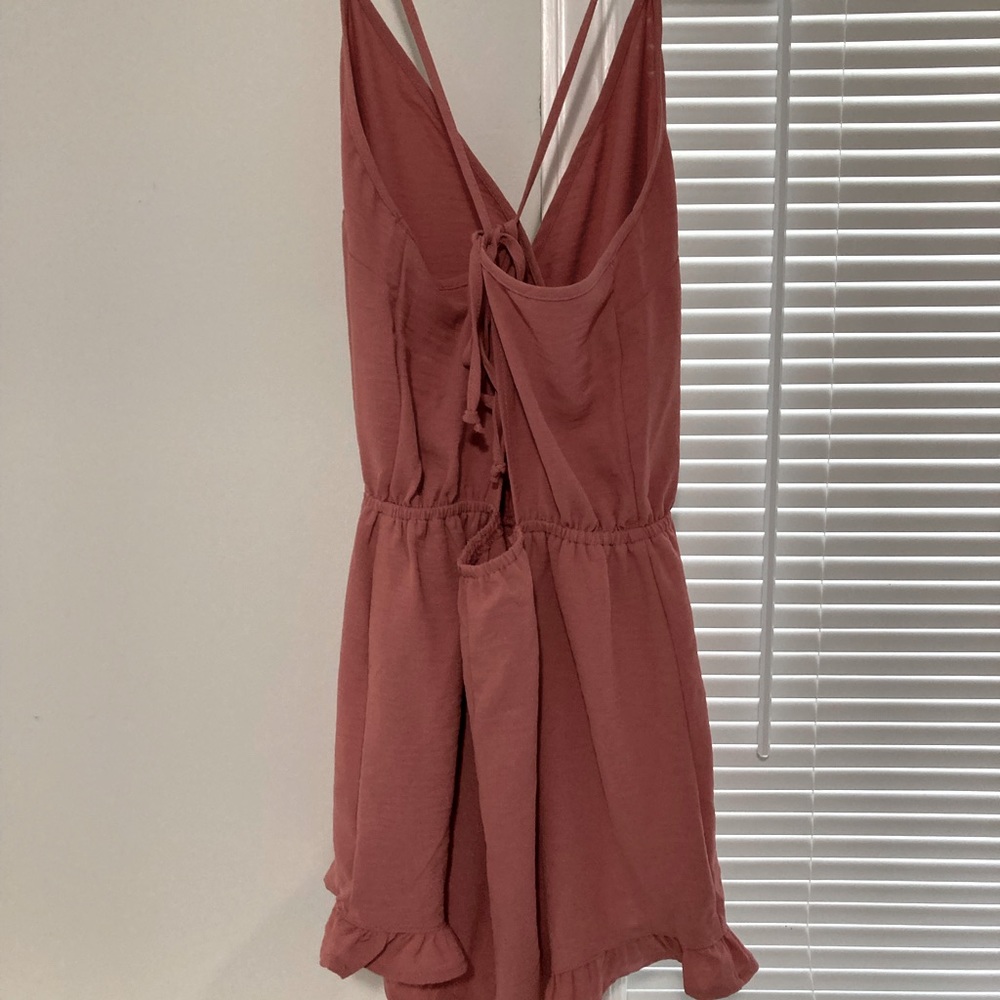 V neck romper with ruffle bottom
